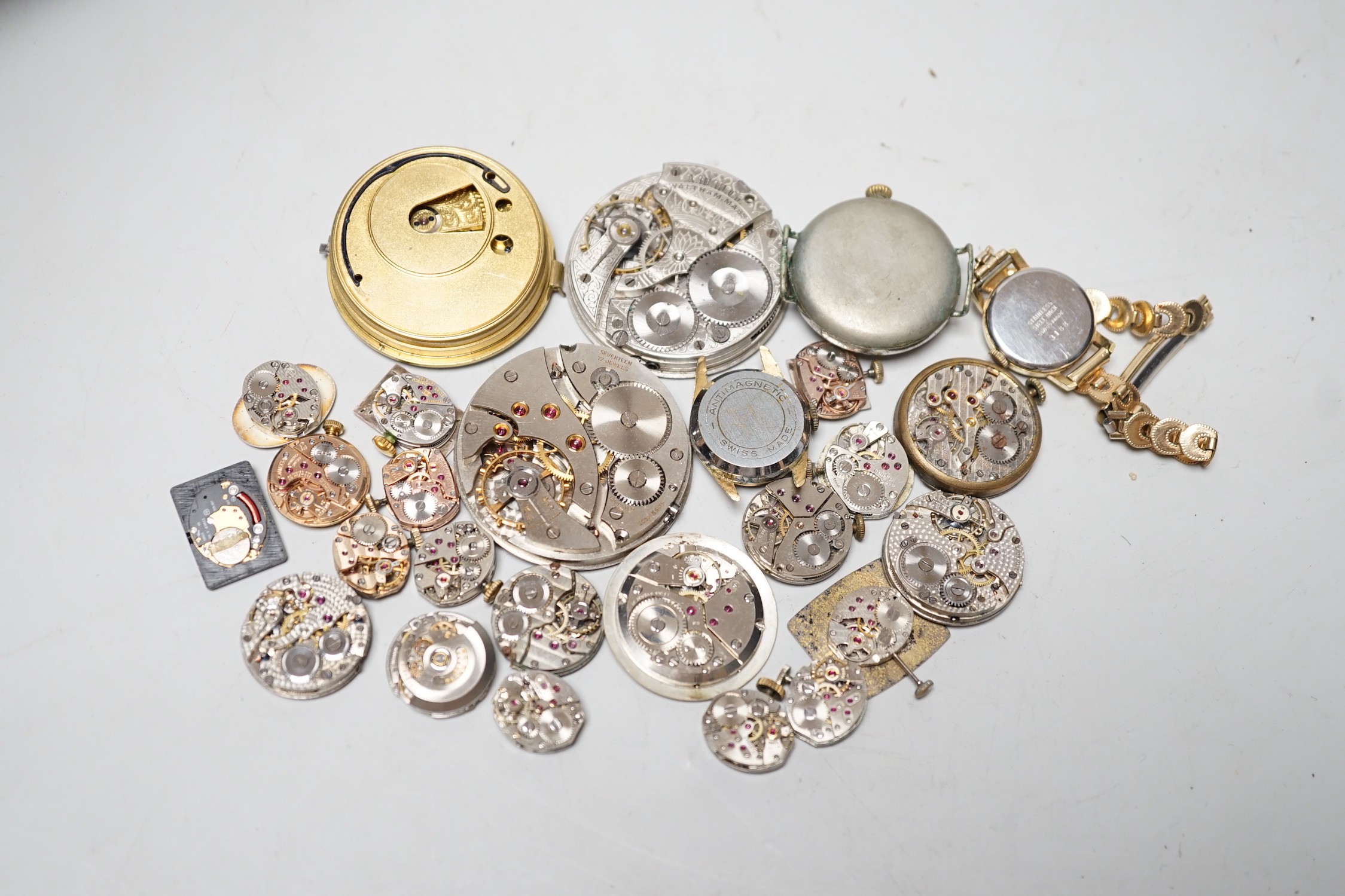 A collection of assorted wrist and pocket watch parts.